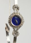 A LADIES' CHOPARD 18CT WHITE GOLD DINNER SET COCKTAIL WATCH with blue face, No. 4093116 813.