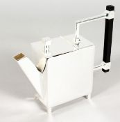 IN THE MANNER OF CHRISTOPHER DRESSER, a silver plated square teapot.