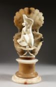 A VERY GOOD LATE 19TH CENTURY ALABASTER GROUP, very well carved as a young female nude seated within