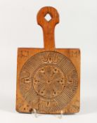 A CARVED WOOD FOLK ART BOARD. 13.5ins high.