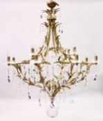 A LARGE AND IMPRESSIVE BRASS AND CUT GLASS TWELVE LIGHT CHANDELIER, with cut glass parts, prism