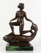 AN UNUSUAL BRONZE GROUP OF A NAKED FEMALE FIGURE RIDING ON THE BACK OF A FISH, mounted on a marble