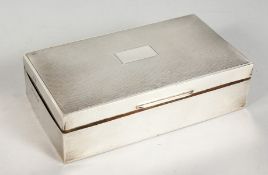 A LARGE ENGINE TURNED SILVER TWO DIVISION CIGARETTE BOX. 6ins long. Birmingham 1965.