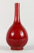 A CHINESE SANG DE BOEUF BOTTLE VASE. 10.5ins high.