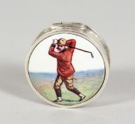 A SILVER CIRCULAR GOLF PILL BOX, with enamel top. 1ins diameter.