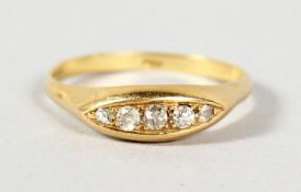 A 9CT GOLD THREE STONE DIAMOND RING.