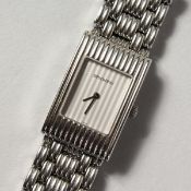 A LADIES' BOUCHERON STAINLESS STEEL WRISTWATCH No. AK 416582 in a white Boucheron pouch.