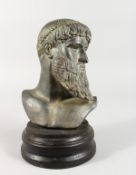 AFTER THE ANTIQUE. A ROMAN POTTERY BUST on a circular wooden base. 8ins high.