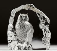 AN INTAGLIO ENGRAVED GLASS ORNAMENT modelled as an owl on a rock, signed. 6ins high.