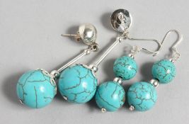 TWO PAIRS OF SILVER AND TURQUOISE EARRINGS. 1.5ins and 1.75ins long.