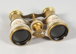A SUPERB PAIR OF SEVRES PORCELAIN OPERA GLASSES, the background painted with young girls and musical