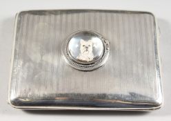 AN ENGINE TURNED SILVER CIGARETTE CASE, inset with an Essex crystal of a dog. Chester 1919.