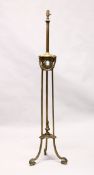 A CLASSICAL ADAM REVIVAL BRASS FLOOR STANDING LAMP, with reeded upper column, ram's head and leaf