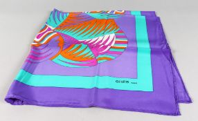 GRES FOULARD. A ladies psychedelic multi-coloured headscarf, with original outer card case.