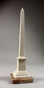 A CARVED STONE OBELISK. 16ins high.
