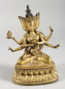 A THAI GILT BRONZE MULTI-ARM SEATED DEITY. 7ins high.