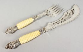 A PAIR OF PLATED FISH SERVERS, with silver mounted ivory handles. 11ins and 15ins long.