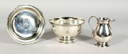 A GEORGE II SILVER THREE PIECE COMMUNION SET, bowl, paten and jug. London 1729. Maker William