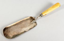 A VICTORIAN SILVER CRUMB SCOOP with bone handle. London 1876. Maker George Adams.