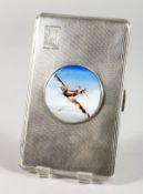 A LARGE ENGINE TURNED SILVER CIGARETTE CASE with a circular enamel plaque of a Spitfire.