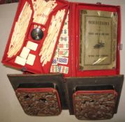 MAHJONG. Boxed game by Wing Fat Cheong of Hong Kong, with instructions, bone tiles & counters, in
