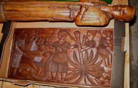 AFRICAN CARVINGS: missionary and Nigerian carved panel depicting figures with a serpent and palm