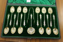 A good cased set of twelve silver gilt apostle spoons with matching sugar sifting spoon and sugar