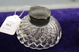 A cut glass inkwell.