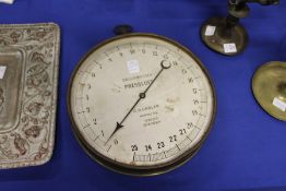 A continental large brass cased pressure gauge.