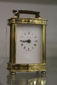 An Asprey's small brass carriage clock.