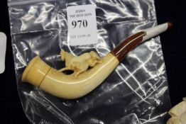 A small Meerschaum pipe.