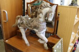 A small carved and painted model of a horse.