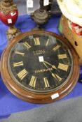 A 19th century oak circular wall clock.