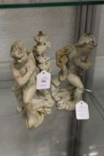 Two painted carved wood figures.