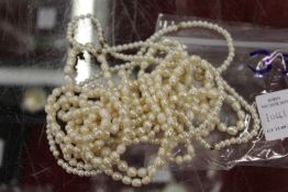 Pearl necklaces.