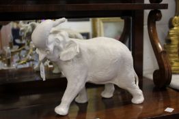 A porcelain model of an elephant.