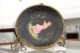 A painted porcelain and ormolu tazza.