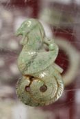 A Chinese carved jade bird shaped amulet.