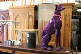 A doggy doorstop and other items.