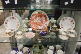 A collection of modern Crown Derby porcelain to include a partridge teapot, plates, cups and saucers