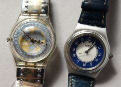 Two Swatch watches.