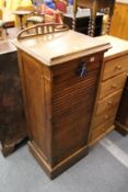 An Edwardian oak filing cabinet.
