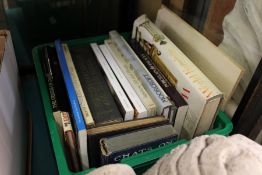 A box of art and antique reference books.