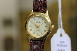 A ladies' quartz wristwatch with leather strap.