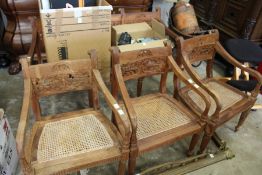 An eastern carved hardwood settee and three armchairs.