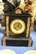 A Victorian black slate mantle clock.