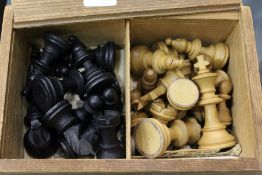 A box containing a quantity of chess pieces.