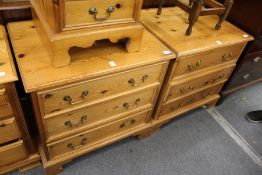 A pair of pine three drawer chests.