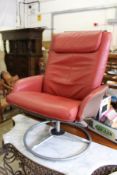 A red leather swivel armchair.