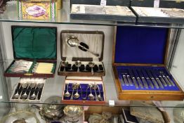 Five cased sets of flatware.